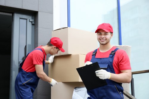 Professional team handling desks and equipment during an office move in Barnet