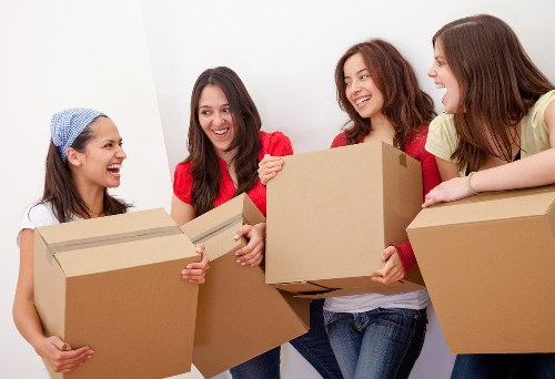 Local furniture removal team handling a bulky item