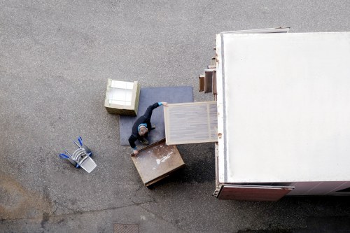 Movers handling furniture in a Barnet residential property