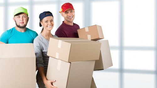 Careful protection and wrapping used during a piano move in Barnet