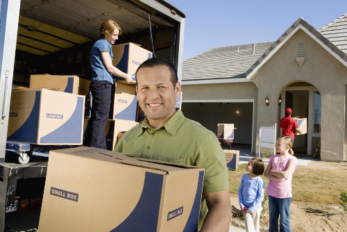 Local moving team handling boxes in Barnet